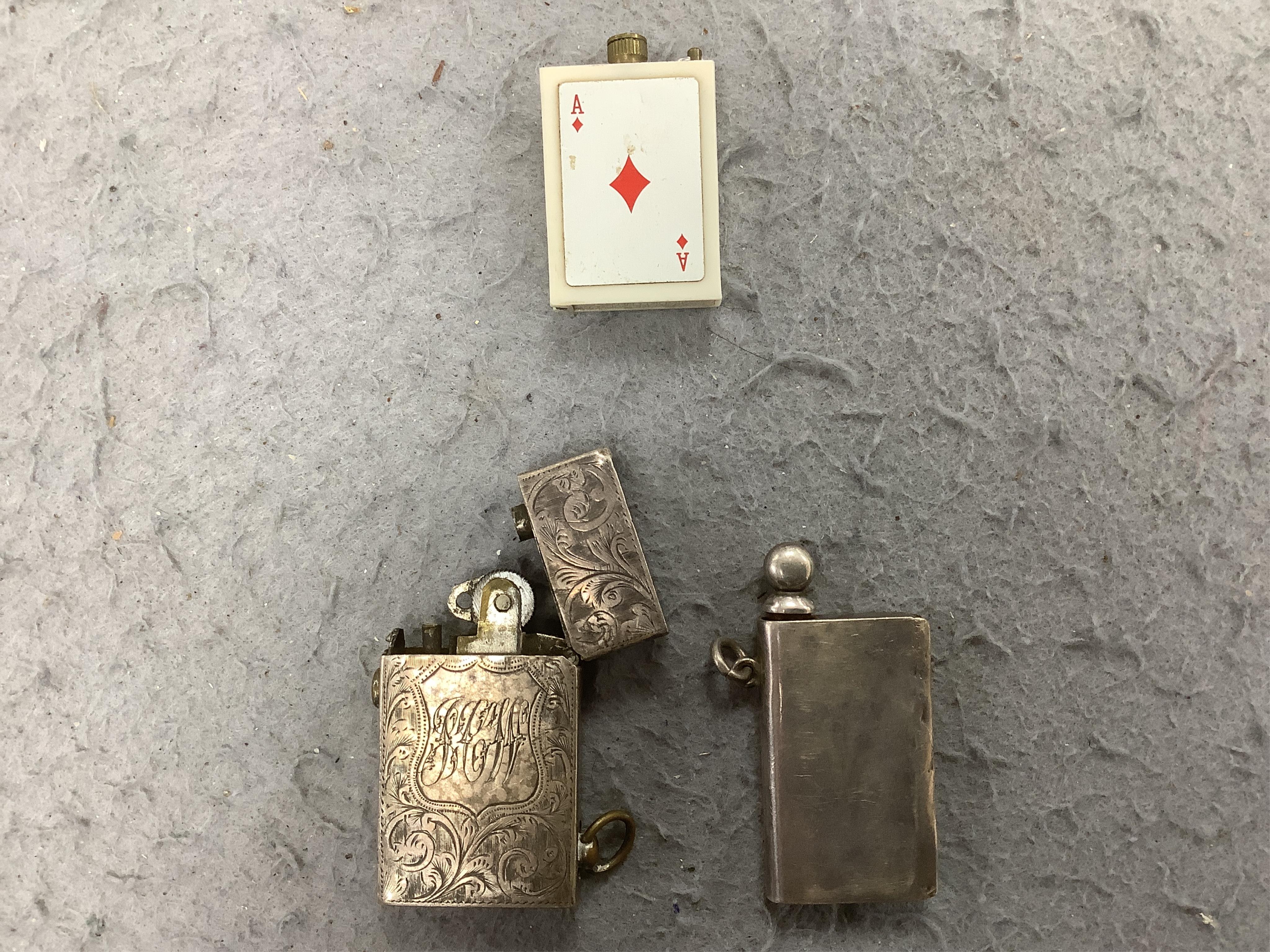 A collection of assorted cigarette lighters, including a large figural lighter, largest 23cm high. Condition - variable